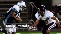 Football players colliding, illustrating conservation of momentum