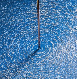 Iron filings showing circular magnetic field around a wire