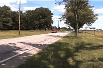 Car moving past an observer, illustrating the Doppler effect
