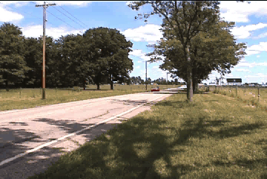 Car moving past an observer, illustrating the Doppler effect at higher speed