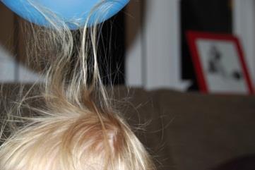 Balloon attracting hair due to static electricity
