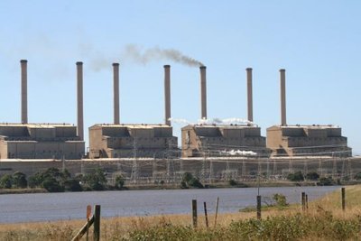 Coal-burning power plant with smoke stacks