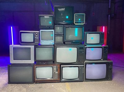 Stack of old cathode ray tube TVs