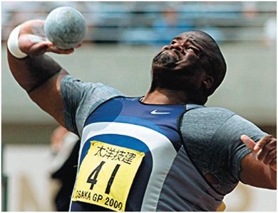 Athlete doing work on a shot put.