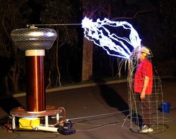 Person protected by a Faraday cage from electric discharge