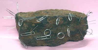 Magnetized iron ore with paper clips