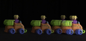 Motion diagram of a toy vehicle showing positions at different times