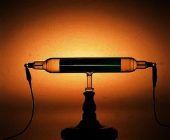 Photograph of cathode ray tube showing green electron beam