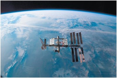 Space station orbiting Earth, illustrating orbital motion and weightlessness