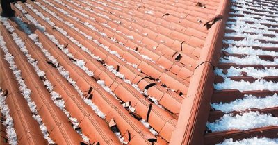 Hailstones damaging a roof