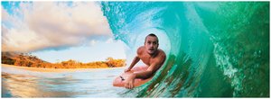 Surfer riding a wave, illustrating a traveling wave in water