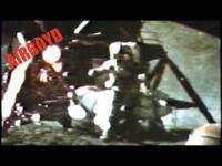 Apollo 15 astronaut performing hammer and feather drop on the Moon