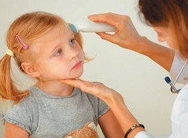 Temporal artery thermometer in use