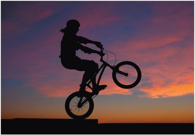 Cyclist balancing on bike