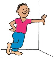 Person pushing against a wall, illustrating action and reaction forces