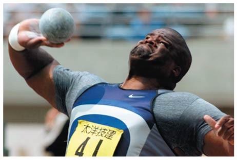 A shot putter transferring kinetic energy to the shot