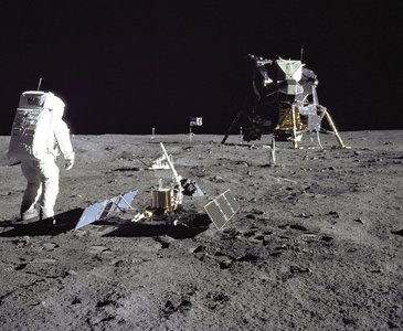 Astronauts on the Moon with TV camera for live transmission