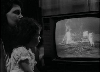 Child watching live Moon landing on television