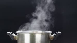 A pot of water boiling without a lid, representing an open system