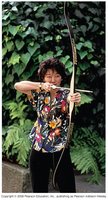 Person drawing a bow, storing potential energy