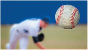 A baseball pitcher throwing a ball, illustrating work done to give the ball kinetic energy