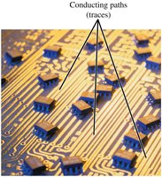 Circuit board with conducting paths (traces)