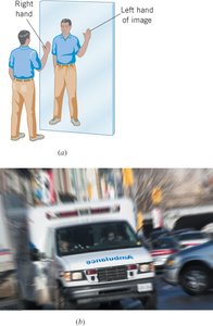 Person in front of a plane mirror showing left-right reversal and emergency vehicle with reversed lettering