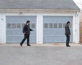 Two people, one walking toward the other, illustrating displacement vector from initial to final position