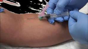 Syringe in use