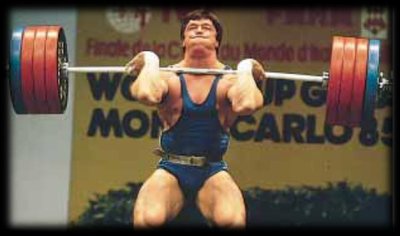 Weightlifter lowering barbell