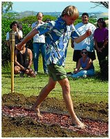 Person walking on hot coals illustrating poor conduction