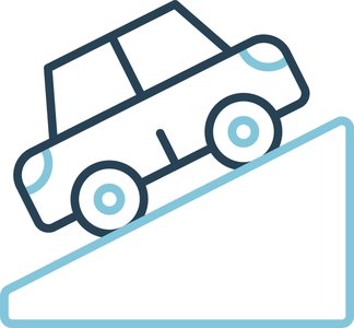Car driving up an incline