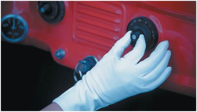 Tuning a radio in a classic car, illustrating the selection of AC signals of different frequencies
