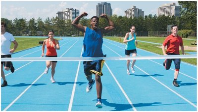 Sprinters crossing the finish line, illustrating motion and velocity