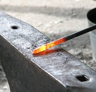 Hot metal transferring heat by conduction