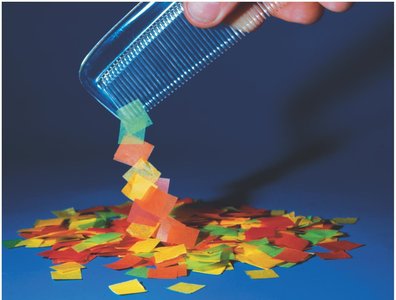 Comb picking up paper pieces due to static electricity