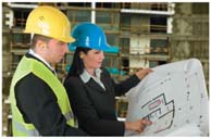 Engineers reviewing a blueprint as an analogy for planning in physics