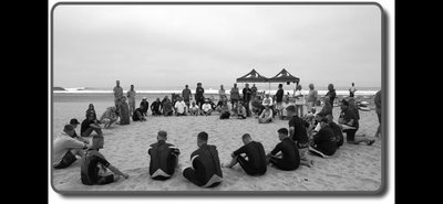 Group therapy session on beach