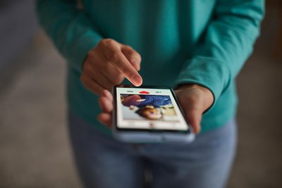 Person using a dating app on a smartphone