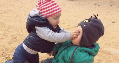 Two children fighting, illustrating direct physical aggression