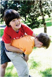 Children engaging in physical bullying