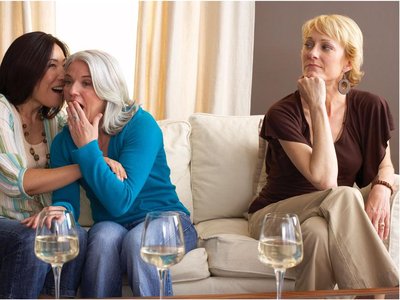 Women gossiping, representing social aggression