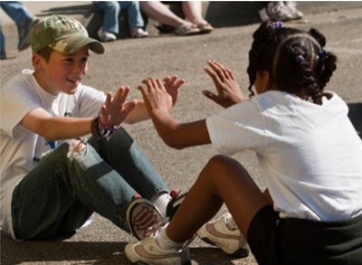 Children of different backgrounds playing together, illustrating intergroup contact