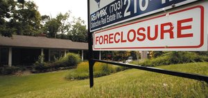 Image of a foreclosure sign, representing financial stress as a variable in psychological research