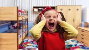 Child covering face in frustration, illustrating emotional response