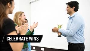 Group celebrating a win, vicarious reinforcement