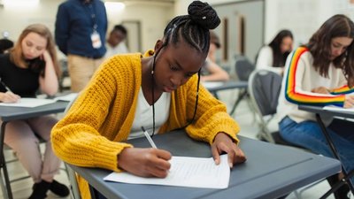 A student taking an exam, illustrating the impact of appraisal on performance