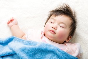 Infant in REM sleep, illustrating neural development