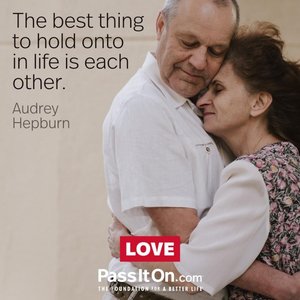 Elderly couple embracing, symbolizing the importance of human connection