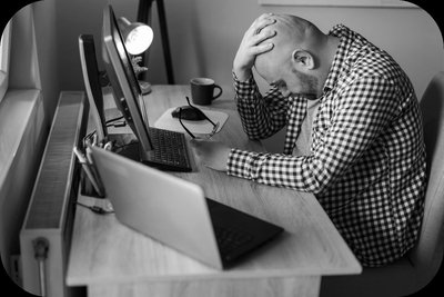 Person experiencing stress at a desk